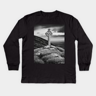 Tall Celtic Cross on the hills of Ireland on a cloudy day in black and white. Kids Long Sleeve T-Shirt